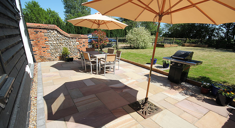 BBQ on patio with dining area