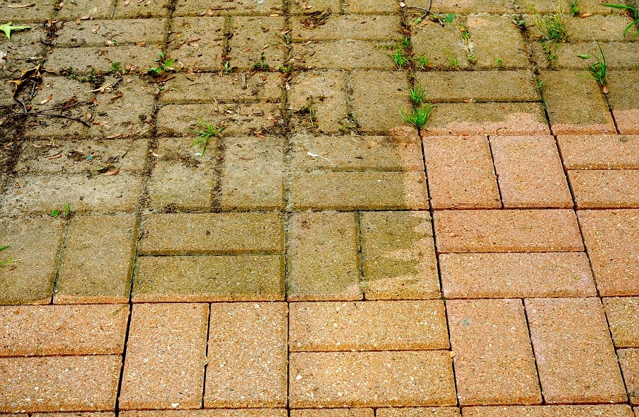 A patio that has been partly pressure washed