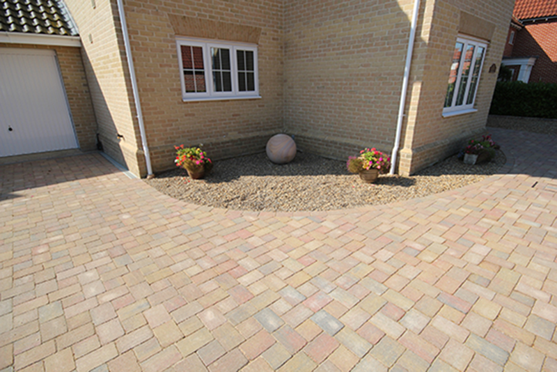 A Paved Driveway In Front Of A House