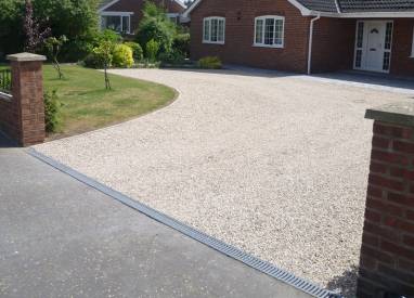 Chip driveway with paving drainage